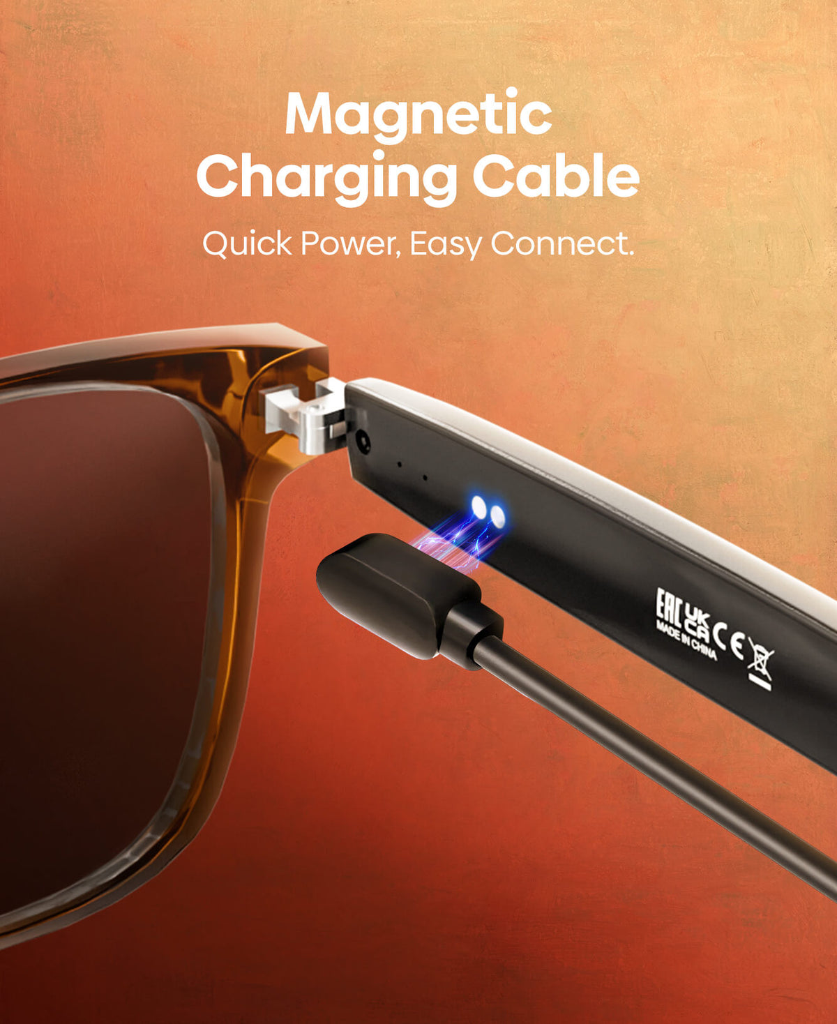 A magnetic charging cable attached to the temple of a brown acetate smart glasses frame, with text reading 'Magnetic Charging Cable' and 'Quick Power, Easy Connect.' on a warm orange gradient background.