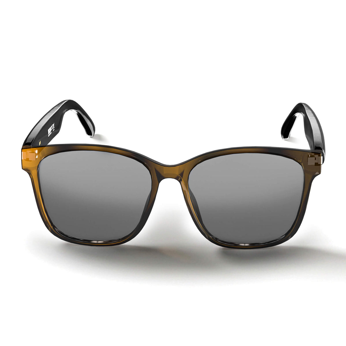A pair of Smart glasses with a translucent amber-brown acetate frame, dark gray lenses, and black temple tips, shown against a plain white background.