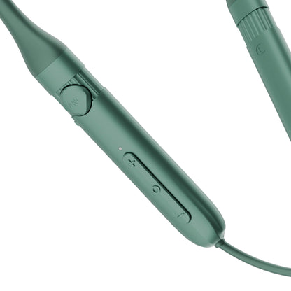 A close-up of a teal green wired electronic device, likely a speaker or control module, showing the inline control buttons and a textured connector on a white background.