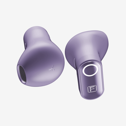 Two lavender-purple wireless earbuds shown on a clean, light off-white background. One earbud is oriented to show the outer surface with a subtle logo, and the other shows the inner surface with a circular opening and a stylized 'F' logo.